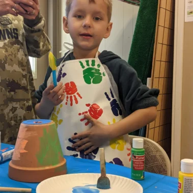 boy painting craft
