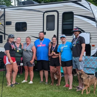camping family with dog