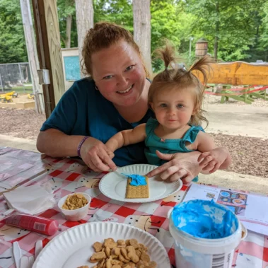 woman and child making crafts